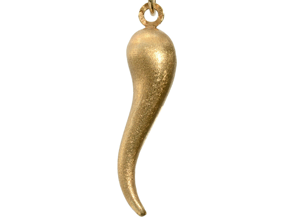 Vintage Italian cornicello horn charm in yellow gold, on white background.