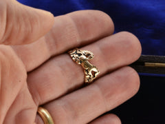 thumbnail of Vintage gold ring with pair of running horses, shown on finger