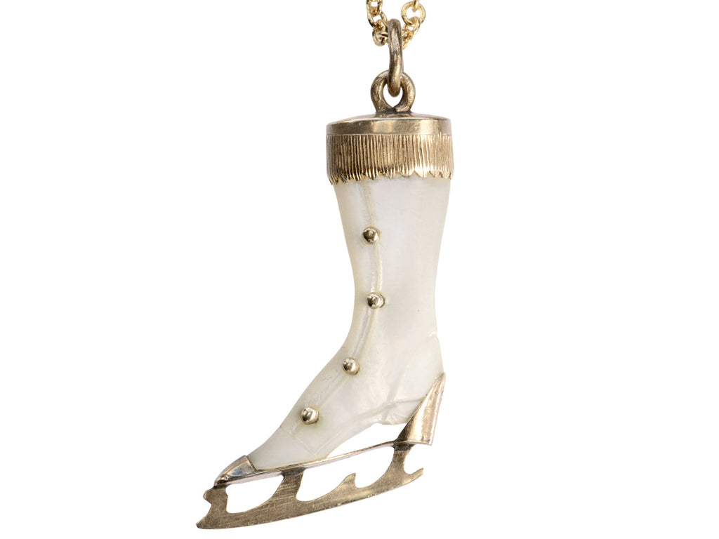 Antique ice skate pendant with mother of pearl and rosy gold fittings (on white background)