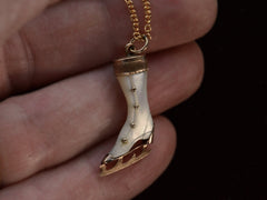 thumbnail of Antique ice skate pendant with mother of pearl and rosy gold fittings (shown on hand)