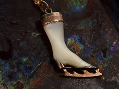 thumbnail of Back of antique ice skate pendant with mother of pearl and rosy gold fittings (on dark colorful background)