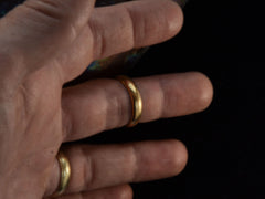 thumbnail of A rounded vintage 4.7mm 18K Italian wedding band, shown on hand.