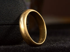 thumbnail of Angled view of a vintage 4.7mm 18K Italian wedding band, shown on dark background.