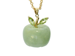 thumbnail of Light green apple shaped pendant carved from jade with a gold stem and peridot leaves, shown on white background.