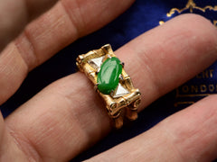 thumbnail of Front view of a vintage gold green jade and triangular diamond with a mounting designed to look like bamboo, shown on finger.