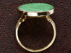 thumbnail of Side profile view of back of antique jade and yellow gold ring, shown on textured background.