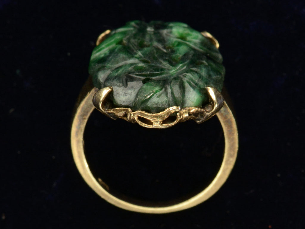 c1920 Carved Jade Ring in Yellow Gold (side profile view on black background)