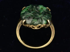 thumbnail of c1920 Carved Jade Ring in Yellow Gold (side profile view on black background)