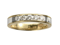 thumbnail of A vintage yellow gold and platinum wedding band with five round diamonds, shown on white background.