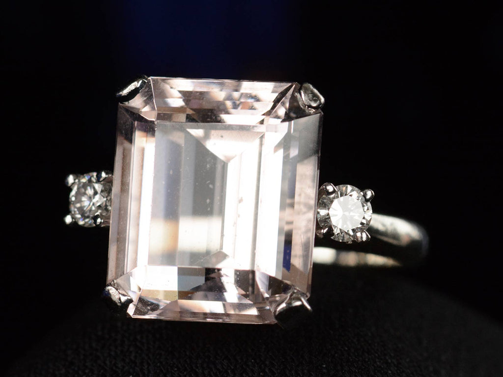 Right angled view of c1950 Kunzite & Diamond Ring (on black background)