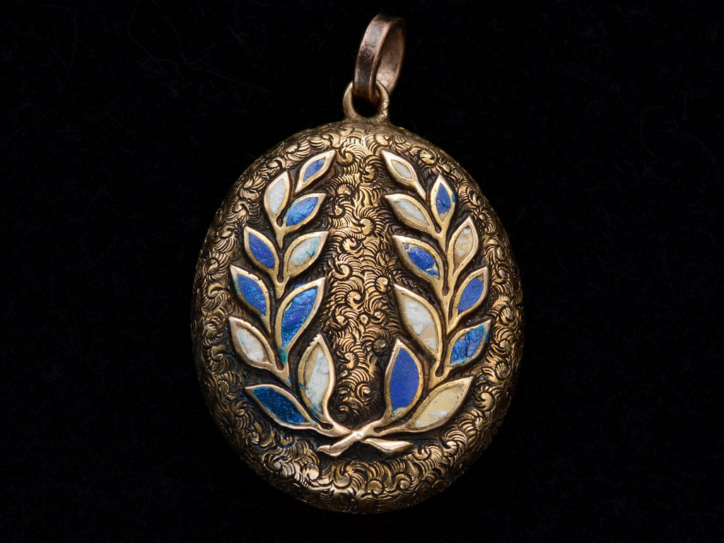 Oval antique gold locket with laurel design in blue and white enamel, shown on black background.