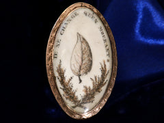 thumbnail of Front view of c1800 Georgian Sepia Miniature of an ivy leaf with the words "je ne change qu'en mourant" (shown on black and blue background)