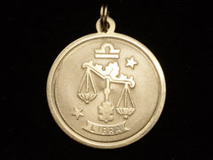 thumbnail of c1970 Gold Libra Charm (on black background)