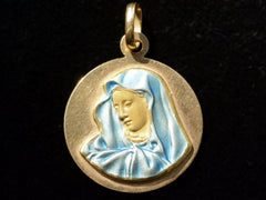 thumbnail of A vintage 18K yellow gold medal with the image of the Virgin Mary in blue enamel, on black background.