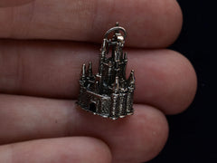 thumbnail of c1990 Silver Disney Castle Charm (on hand for scale) 