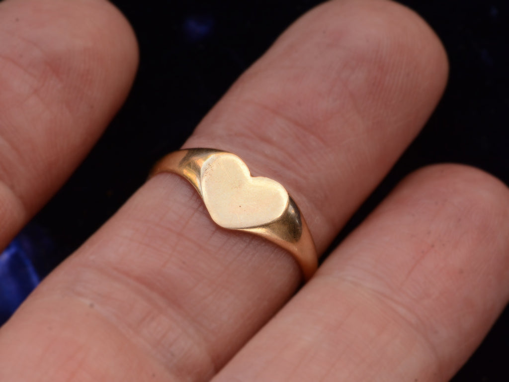 c1920 Heart Signet Ring (on finger for scale)