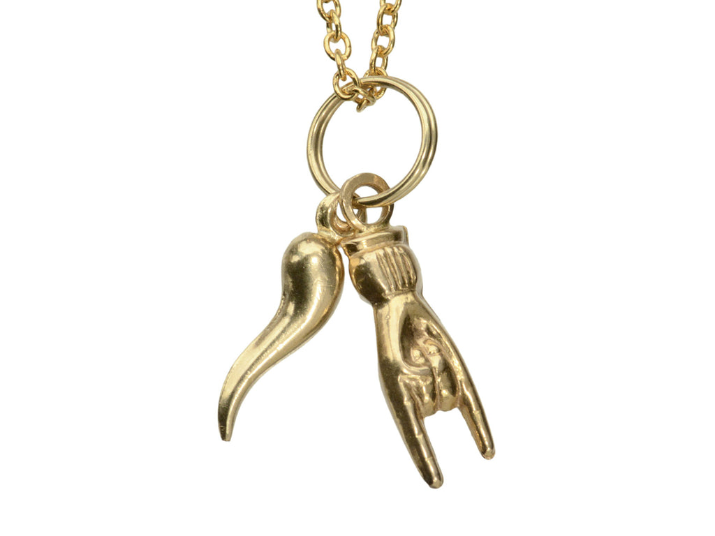 Pair of vintage gold Italian charms: a horn and a hand gesturing the sign of the horns. Shown on white background.