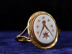 thumbnail of c1900 Masonic Intaglio Ring (left side view on dark blue background)