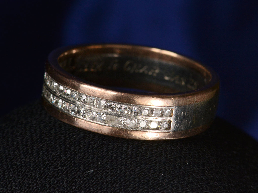 Angled view of Vintage Men's Diamond Band in Platinum and Rose Gold (shown on dark background)