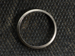 thumbnail of Side profile of a 14K white gold c1940 wedding band with milgrain edges, shown on dark textured background.