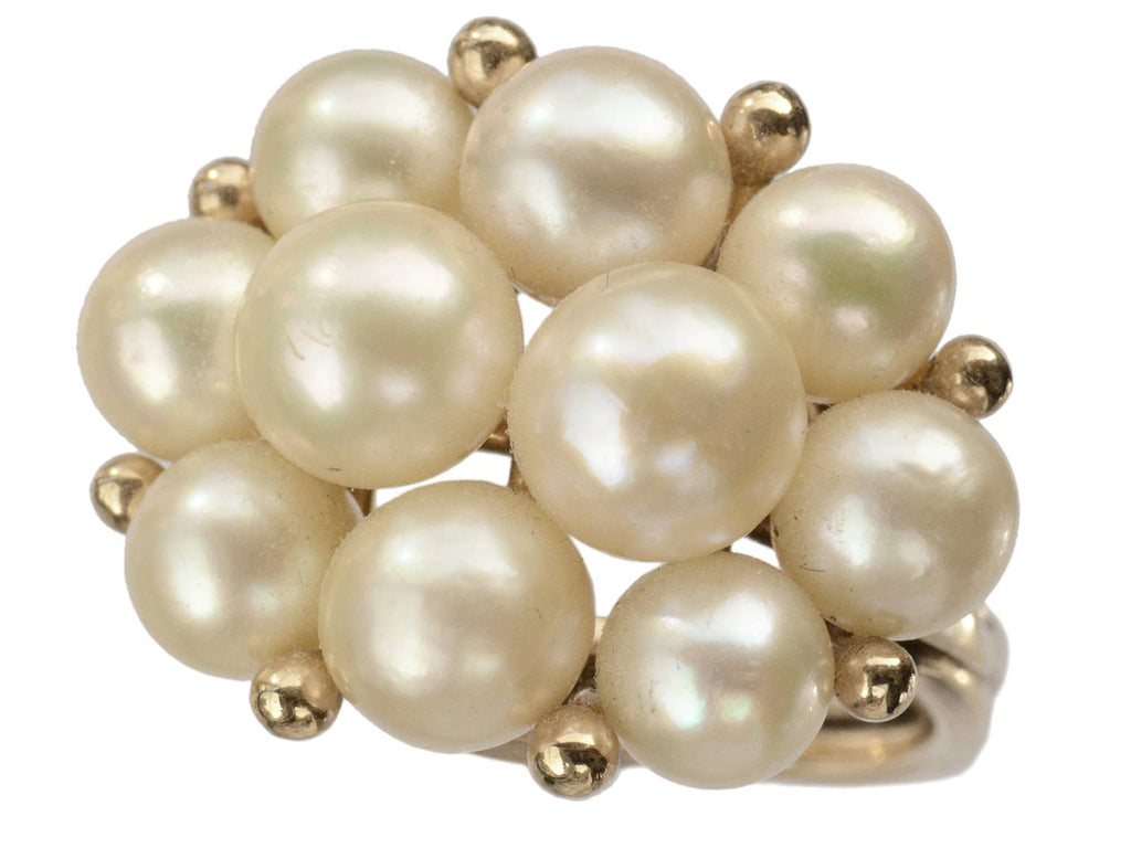 Right angle view of c1960 Ming's Pearl Ring on white background