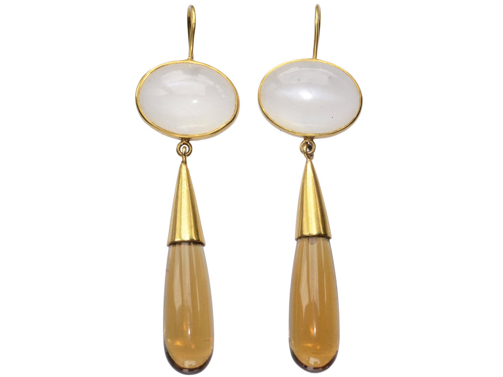 Pair of 18K yellow gold earrings with oval moonstone tops and amber-colored quartz teardrop pendants, shown on white background.