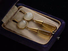 thumbnail of Pair of 18K yellow gold earrings with oval moonstone tops and amber-colored quartz teardrop pendants, shown in vintage box.