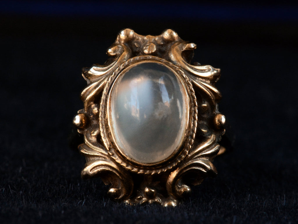 Front view of c1920 Nouveau Moonstone and Gold Ring (on dark background)