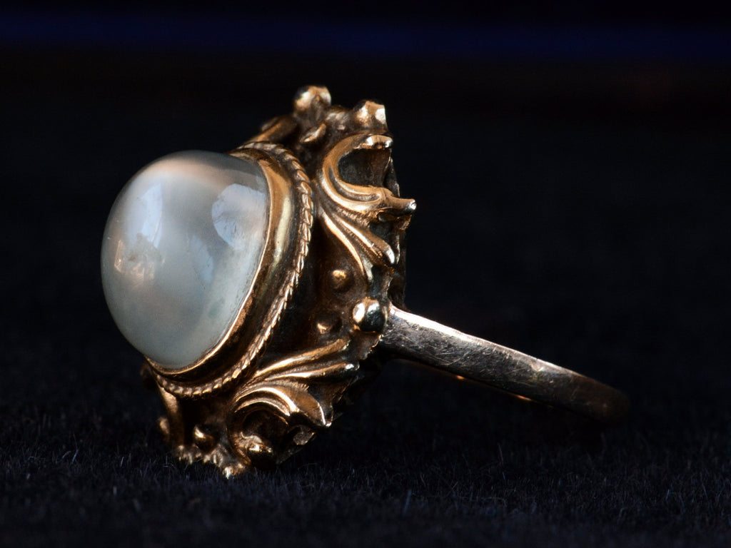 Side angled view of c1920 Nouveau Moonstone and Gold Ring (on dark background)