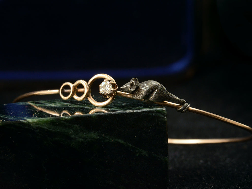 Detail right angle view of c1890 Diamond Mouse Bracelet on dark background