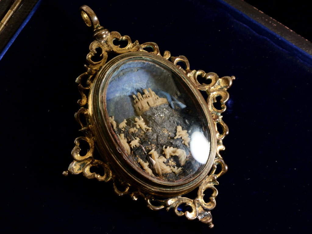 Front view of c1850 Nativity Miniature Pendant (on black background)