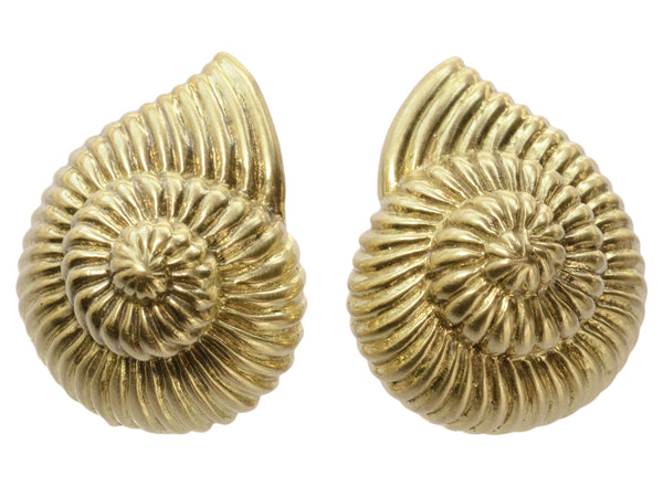 Pair of yellow gold ammonite shaped earrings, shown on white background.