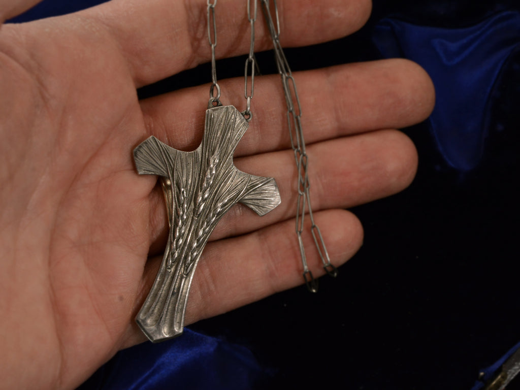 c1900 Art Nouveau Cross with wheat design in silver (shown on hand for scale)