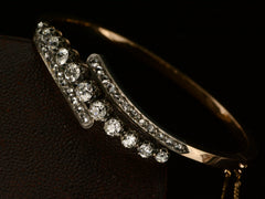 thumbnail of Close up, angled view of platinum topped yellow gold Art Nouveau bracelet with rows of old European cut and rose cut diamonds, shown on dark background.