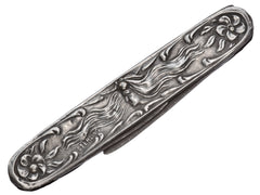 thumbnail of Art Nouveau silver pocket knife with imagery of a woman and flowers, shown on white background.