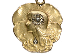 thumbnail of c1910 Art Nouveau yellow gold pansy shaped pendant with the profile of a woman (shown on white background)