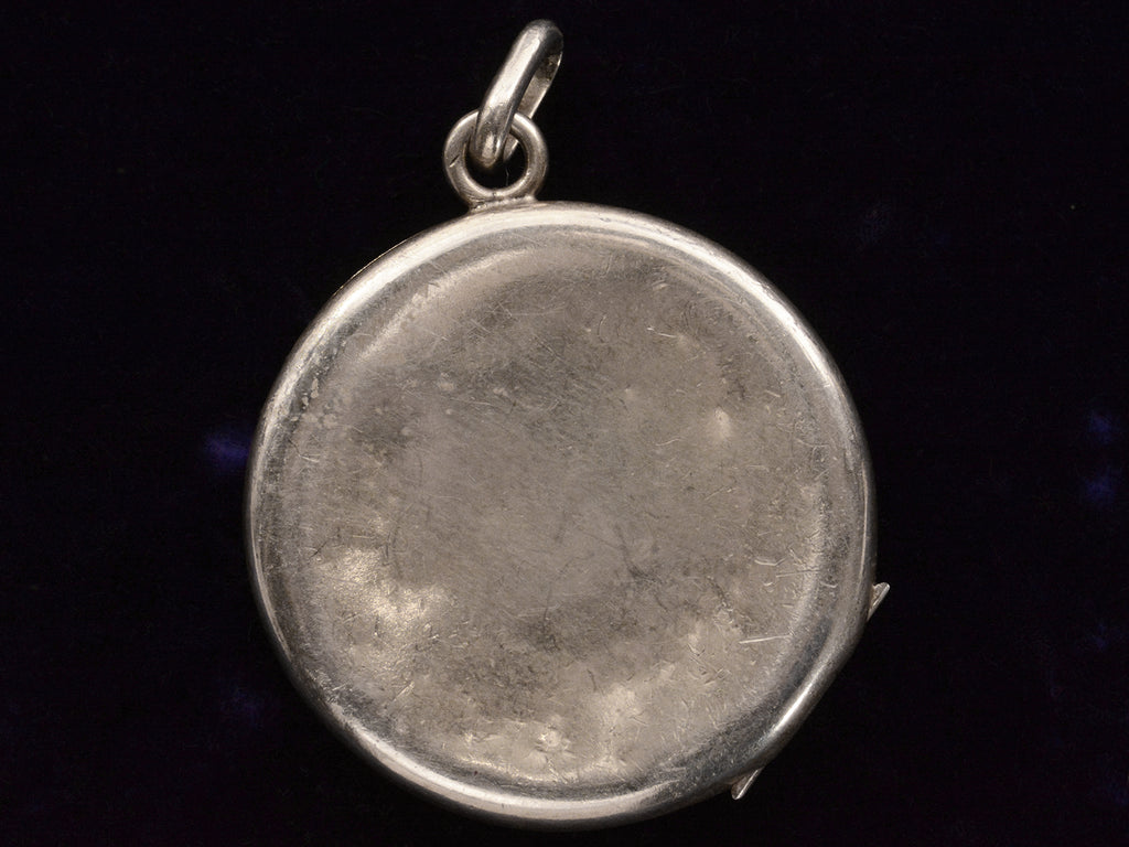 Reverse side of c1900 Art Nouveau Silver Locket (on black background)