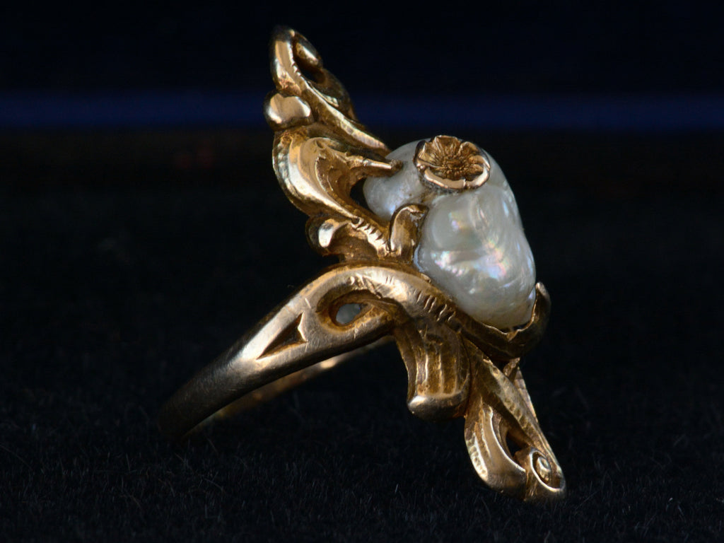 Left side view of c1890 Nouveau Pearl and Gold Ring (on black background)