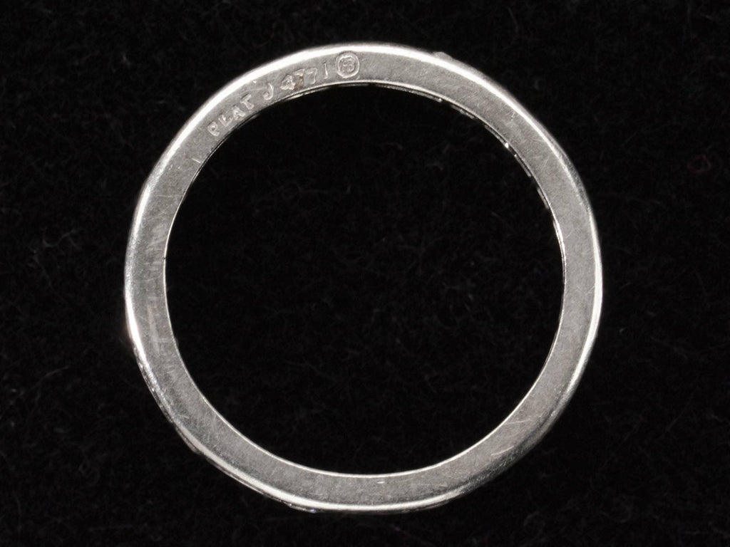 Side profile view of c1950 Oscar Heyman Eternity Band with Baguettes and Round Diamonds in Platinum (shown on dark background). Stamps on side read "PLAT J 4771 HB"