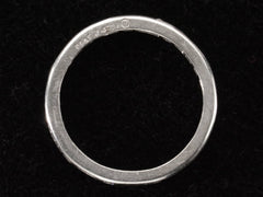 thumbnail of Side profile view of c1950 Oscar Heyman Eternity Band with Baguettes and Round Diamonds in Platinum (shown on dark background). Stamps on side read "PLAT J 4771 HB"