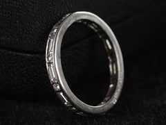 thumbnail of Angled side profile view of c1950 Oscar Heyman Eternity Band with Baguettes and Round Diamonds in Platinum (shown on dark background)