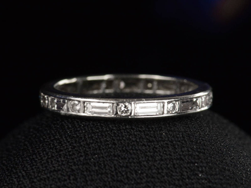 c1950 Oscar Heyman Eternity Band with Baguettes and Round Diamonds in Platinum (shown on black background)