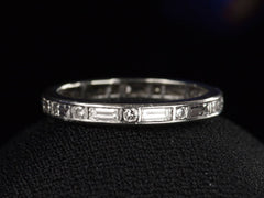 thumbnail of c1950 Oscar Heyman Eternity Band with Baguettes and Round Diamonds in Platinum (shown on black background)