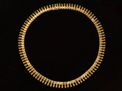 thumbnail of A c1930 Victorian-style 18K rosy-yellow gold collar shown without opal bib on black background.