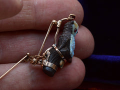 thumbnail of c1900 Carved Opal Owl (on hand for scale)