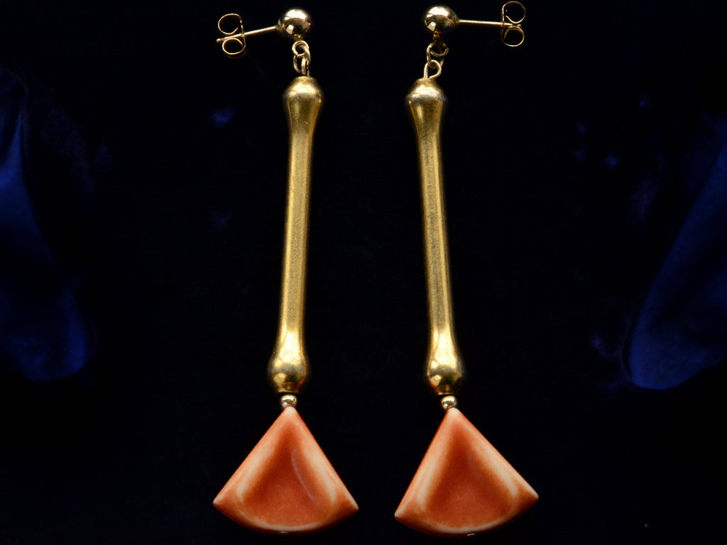 c1930 Deco Drop Earrings in Gilt Metal and Orange Plastic (shown on dark blue background)