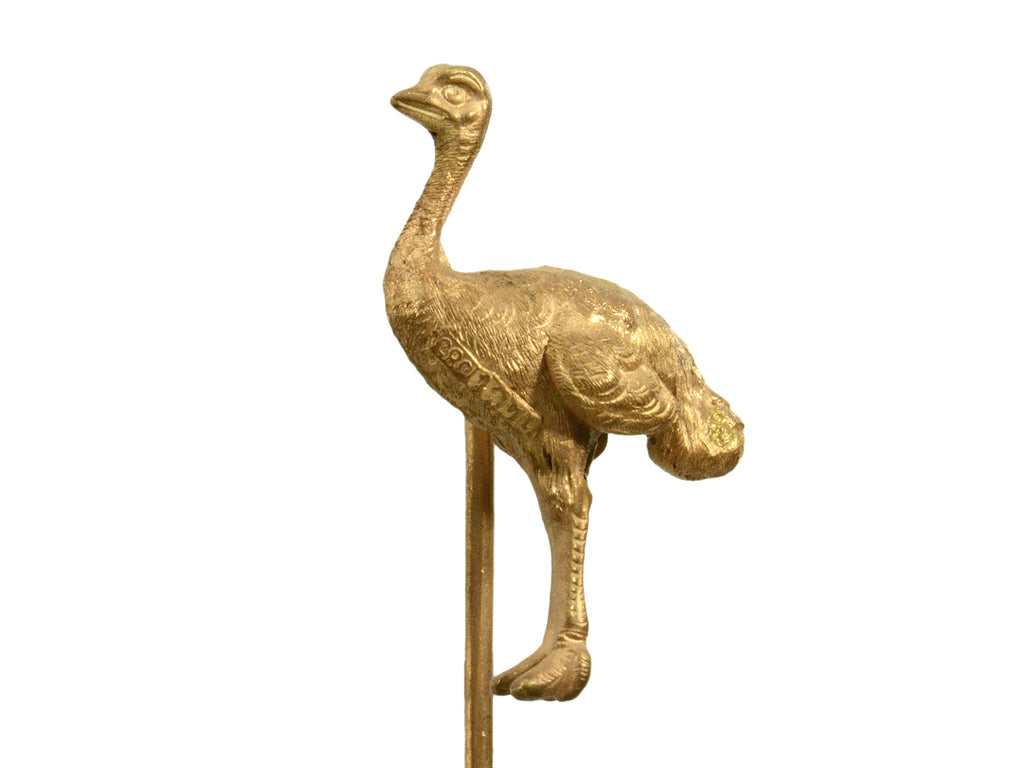 Antique yellow gold ostrich stick pin (on white background) A mark stamped "14ct 585" is visible.