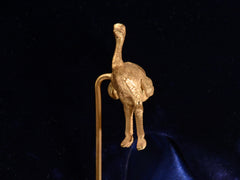 thumbnail of Front view of Antique yellow gold ostrich stick pin (on black background) A mark stamped "14ct 585" is visible.