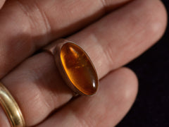 thumbnail of Finger wearing a c1980 Oval Amber Ring in Sterling Silver