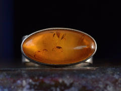 thumbnail of Front profile view of c1980 Oval Amber Ring in Sterling Silver (on dark background)